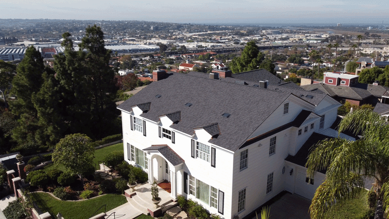 Dils Roofing crew completing an emergency roof repair and shingle installation in San Diego